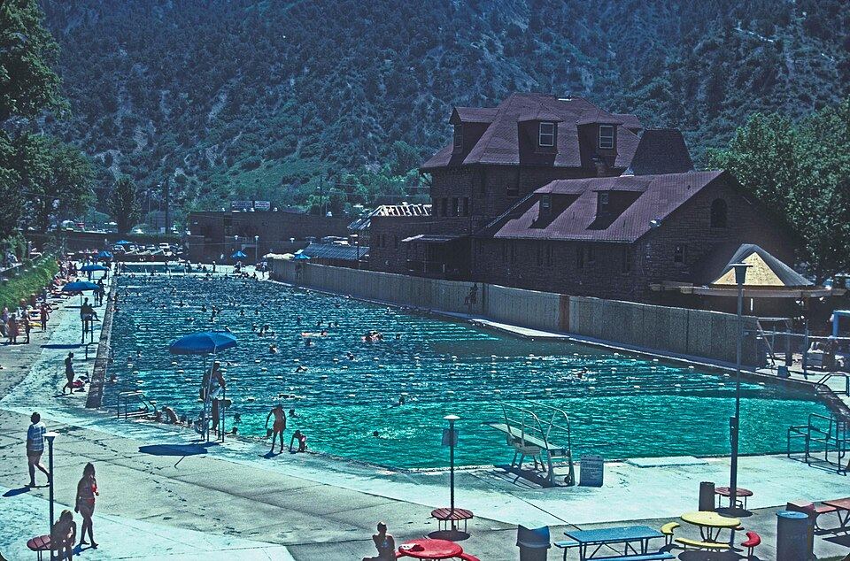 Natural hot springs pool with mountain scenery
