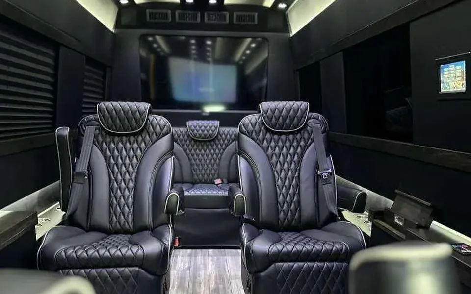 Executive Sprinter van interior with leather captain's chairs